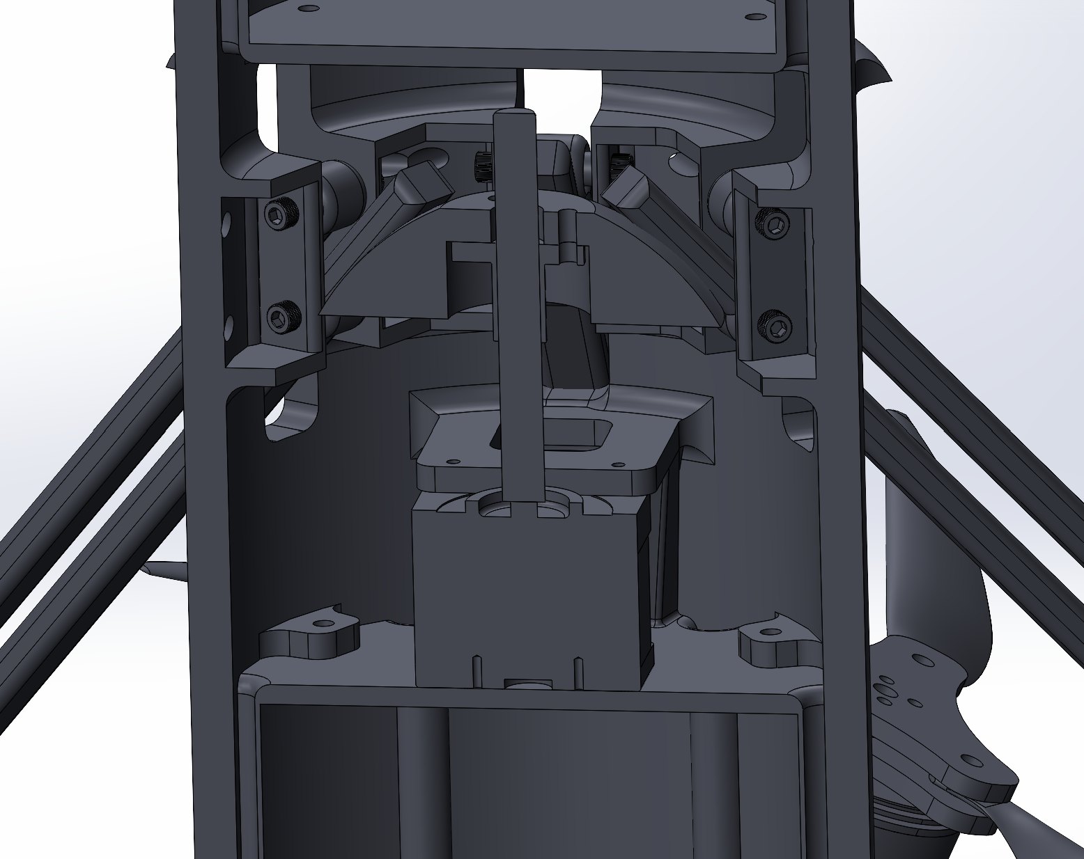 Wider section — arm linkage pivots and the pass-through into the hull.