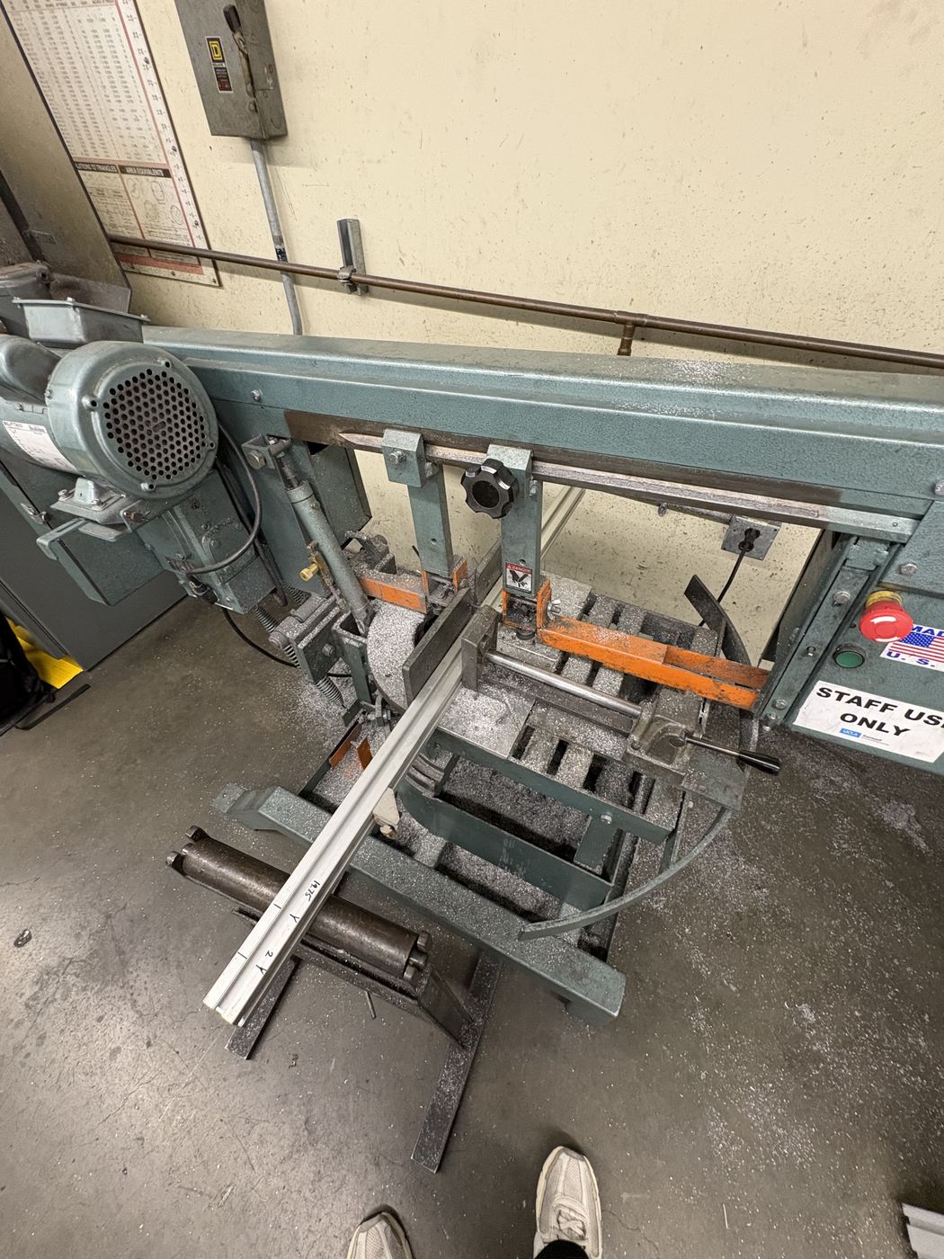 Aluminium extrusion stock being cut to length on the horizontal bandsaw.